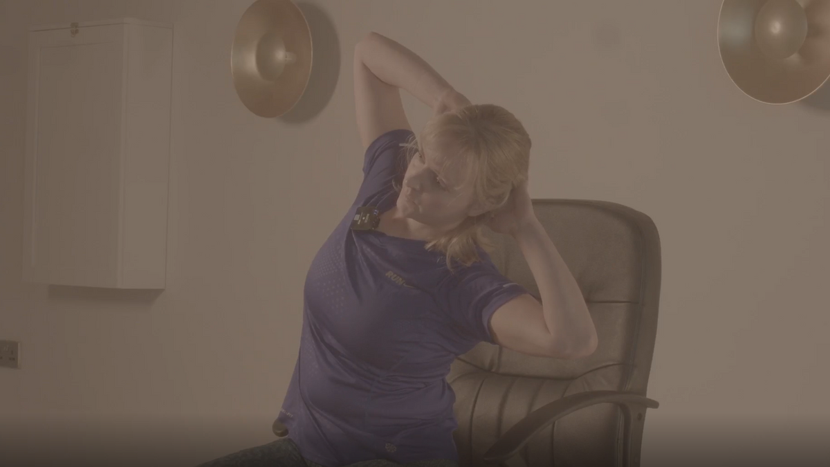 Close up shot of an instructor performing one of our seated hernia rehabilitation exercises.